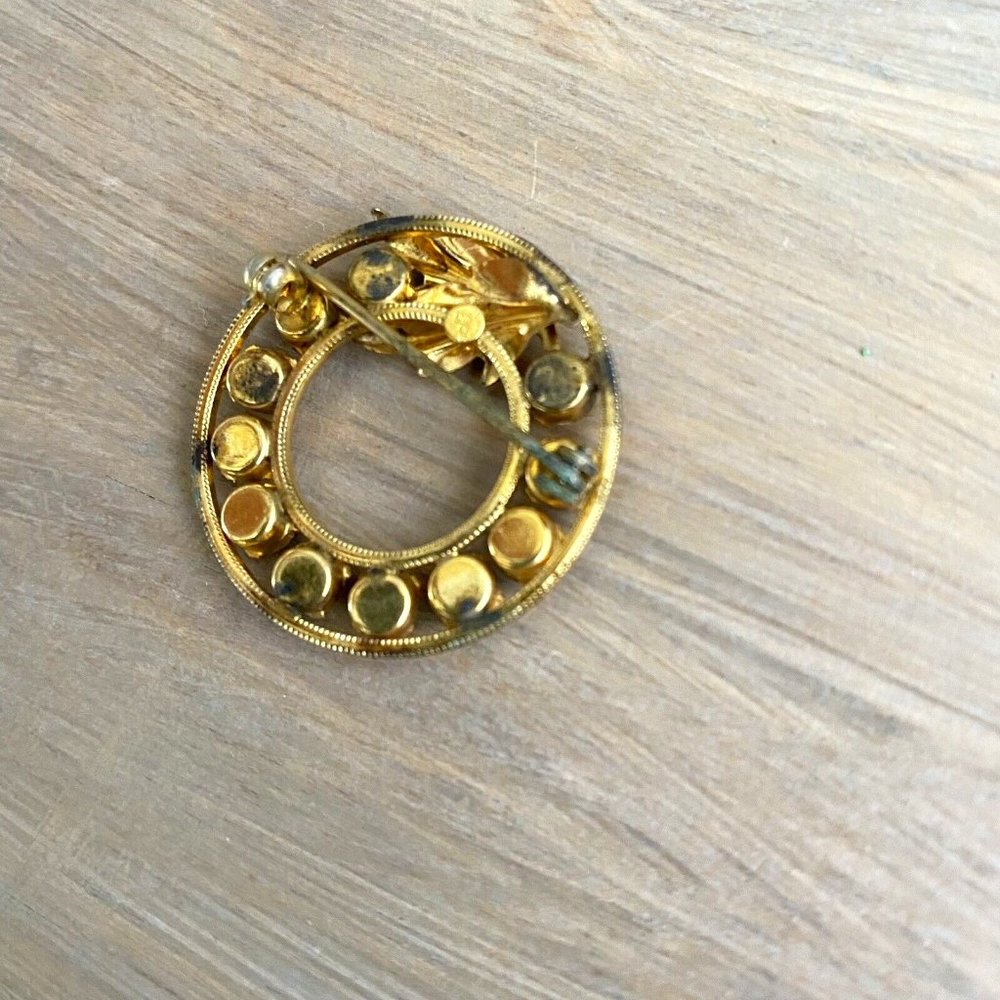 Vintage multicolored rhinestone circle brooch leaf accent Estate Jewelry